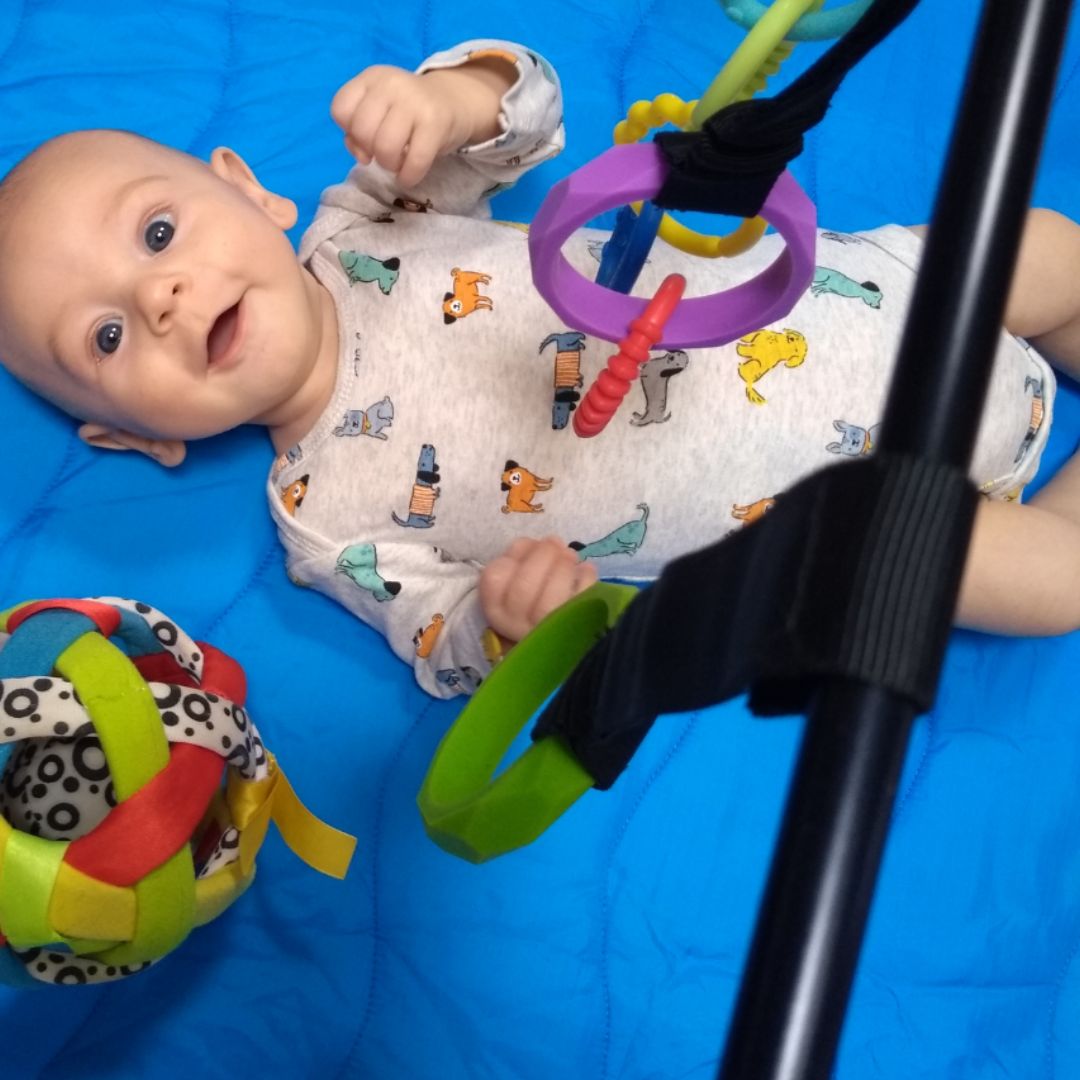 Happy baby on Lay and Play Adventure Mat